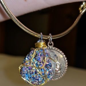 Gold wraped rainbow quartz bracelet with bhudda